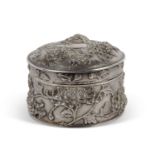 Late 19th/early 20th Century Chinese export silver circular lidded box heavily chased embossed