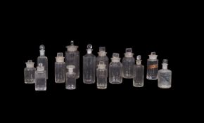 Quantity of small clear glass chemist bottles mostly with covers, some with original string cloth