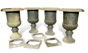 Set of four continental cast iron garden urns decorated with continuous scenes of figures and