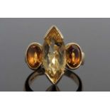 18ct gold citrine designer ring centering a Marquise shaped lemon citrine flanked by two oval cognac