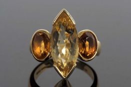 18ct gold citrine designer ring centering a Marquise shaped lemon citrine flanked by two oval cognac