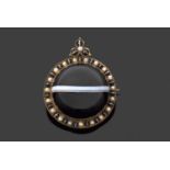 Victorian banded agate brooch, the large round cabochon agate, 30mm diameter set within a frame of