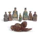 Tang style pottery model of a figure on a chicken, together with a group of seven wooden Han style