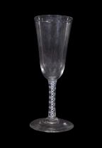 Cordial glass with drawn bowl above an opaque twist and a multi spiral tape stem, 19cm high