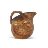 Martinware double sided face jug, the base marked R W Martin Bros, London & Southall 1901, 23cm