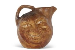 Martinware double sided face jug, the base marked R W Martin Bros, London & Southall 1901, 23cm