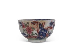 Rare Lowestoft small tea bowl of ribbed form with a redgrave pattern of fence and flowers within a