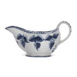 Rare Lowestoft porcelain sauce boat with a moulded fruiting and berry design picked out in blue,