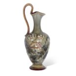 Doulton Lambeth ewer with an incised art nouveau design in brown and green slip by Frank Butler,