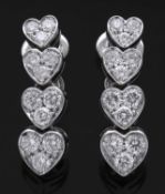 Pair of diamond heart pendant earrings, a style featuring 4 articulated graduated heart diamond