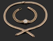9ct gold necklace, a overlapping fox tail link design together with a ladies Verity 9ct gold watch