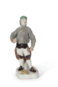 19th Century Meissen model of a miner in typical pose, cross swords and impressed numerals to