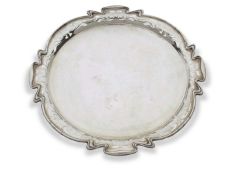 Edward VII shaped circular tray in Art Nouveau style, the wavey edge pierced with abstract foliate