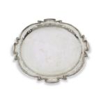 Edward VII shaped circular tray in Art Nouveau style, the wavey edge pierced with abstract foliate