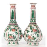 Good pair of Kangxi famille vert bottle vases decorated with flowers in a famille rose pallette,
