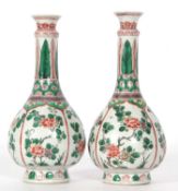 Good pair of Kangxi famille vert bottle vases decorated with flowers in a famille rose pallette,