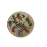 Chinese glass medallion with applied hard stone decoration in relief of branches and leaves with