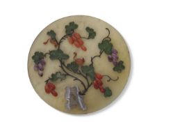Chinese glass medallion with applied hard stone decoration in relief of branches and leaves with
