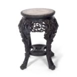 Chinese hardwood and marble inset jardiniere stand, a circular top over a pierced freeze and four