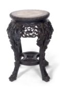 Chinese hardwood and marble inset jardiniere stand, a circular top over a pierced freeze and four