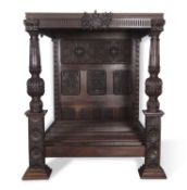 Large Elizabethan style dark oak tester bed with heavy ribbed posts and intricate floral and foliate