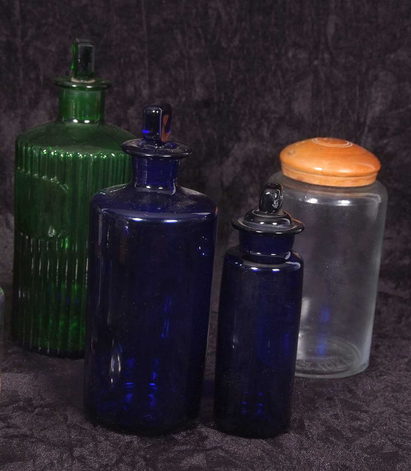Quantity of clear glass and coloured glass chemist jars with covers or stoppers including four - Image 3 of 4