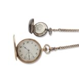 9ct gold Hunter pocket watch with a 9ct gold chain and silver coin holder fob, the pocket watch is