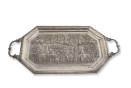 Interesting 19th/20th Century Indian white metal two handled tea tray of elongated octagonal form,