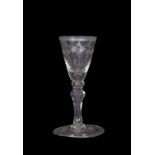 Georgian wine glass with swag engraving to the fluted bowl and triple knop above a clear stem,