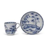 Lowestoft blue and white coffee cup and saucer, circa 1770 painted with a fence and tree pattern
