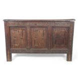 18th Century oak coffer, solid board lid over a front with three panels with inlaid decoration