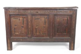 18th Century oak coffer, solid board lid over a front with three panels with inlaid decoration