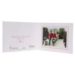 Christmas card from Charles and Diana signed in black ink, the interior with a photo of Charles