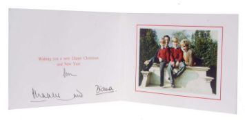 Christmas card from Charles and Diana signed in black ink, the interior with a photo of Charles