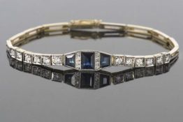 Precious metal sapphire and diamond line bracelet centering three calibre cut sapphires and two
