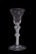 A wine glass, the pan top above a knop air twist stem with medium knop, 15cm high