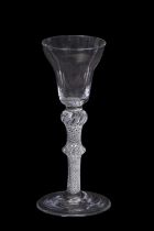 A wine glass, the pan top above a knop air twist stem with medium knop, 15cm high