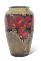 Large early 20th Century Moorcroft pomegranate vase on a green ground, the ovoid body with full