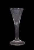 Georgian wine glass, the trumpet bowl above a clear stem and domed foot, 15cm high