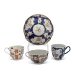 Worcester cup and saucer Kakiemon designs within blue ground panels together with a rich queen
