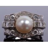 Precious metal pearl and diamond cocktail ring centering a cultured pearl (8mm diameter), raised