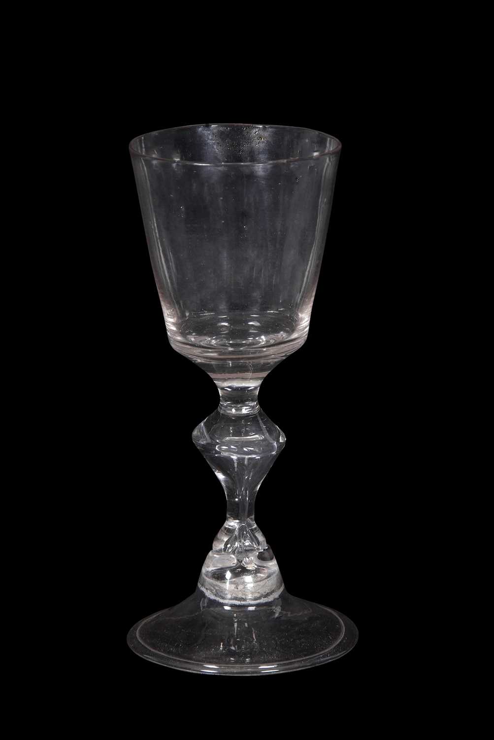 18th Century wine glass, rounded funnel bowl above a inverted baluster stem on domed foot, 14cm