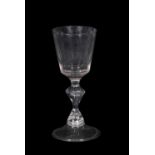 18th Century wine glass, rounded funnel bowl above a inverted baluster stem on domed foot, 14cm