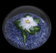 19th century St Louis miniature paperweight with a white flower and green leaves on a blue and white