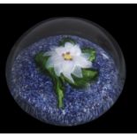 19th century St Louis miniature paperweight with a white flower and green leaves on a blue and white