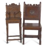 17th Century and later oak hall chair with panelled back and central carved floral medallion over