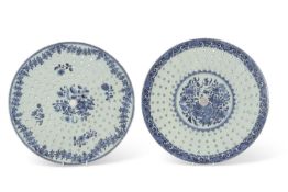 Two 18th Century Chinese porcelain large circular strainers with blue and white designs, 36cm