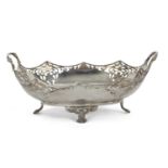 George V two handled fruit bowl of shaped oval design having pierced panels to the corners, two