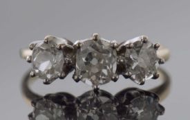 Three stone diamond ring featuring three graduated old cut diamonds, 0.90ct approx, size K