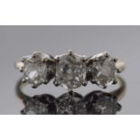 Three stone diamond ring featuring three graduated old cut diamonds, 0.90ct approx, size K